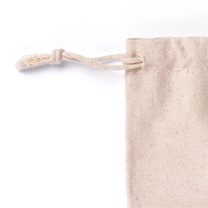 Natural beige canvas drawstring bag made of breathable cotton fabric for gift storage