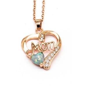 Close-up of rose gold Mom heart pendant with opal and sparkling cubic zirconia stones