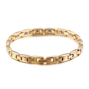 Gold-toned titanium steel magnetic link bracelet for men and women on white background