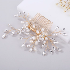 Elegant bridal hair comb with pearls and crystals on a minimalist white stand