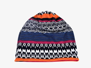 Detail of colorful ethnic pattern knit hat with geometric wave designs and soft texture