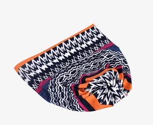 Detailed view of bohemian style headband with multi-color geometric wave patterns