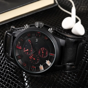 Macro shot of K-TEVI chronograph watch with black leather strap and red dial details