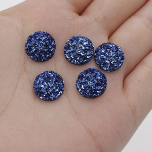 Close-up of five 12mm deep blue starry resin druzy cabochons for DIY jewelry making