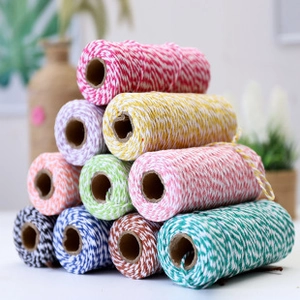 Close-up of assorted 1.5mm double-colored cotton bakers twine rolls for gift wrapping