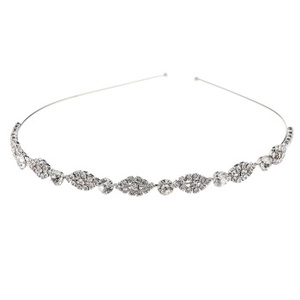Macro shot of silver rhinestone bridal headband with delicate leaf-shaped crystals
