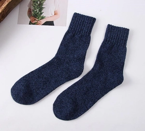 Thick wool blend men winter socks detail view showing heather dark blue knitted texture fabric.
