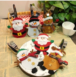 Detail of Christmas cutlery holders featuring Santa, Snowman and Reindeer felt designs
