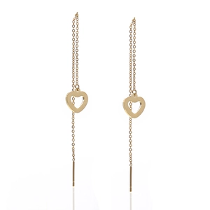Close-up of golden threader earrings with hollow heart charms and thin link chains