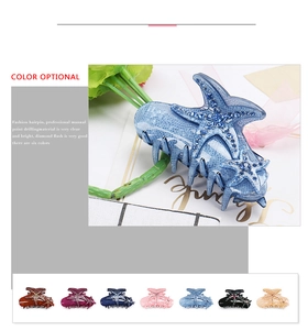 Macro view of crystal starfish hair claws in multiple colors including deep blue and pink