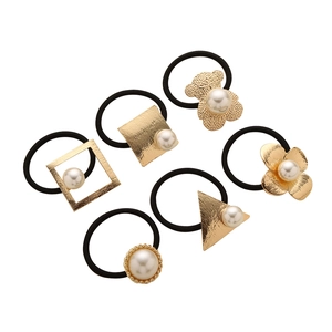 Set of 6 high-elastic black hair ties with golden metal charms and white pearl accents