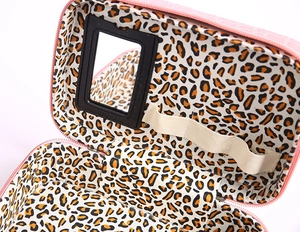 Pink crocodile texture makeup case featuring leopard print lining and internal mirror detail