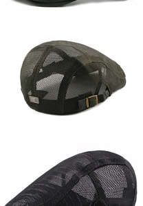 Detail of army green and black mesh newsboy caps with vintage metal buckle and S-tag