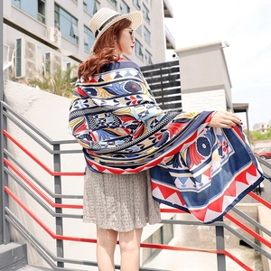 Detailed view of bohemian style ethnic print shawl with vibrant geometric patterns