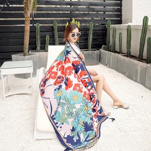 Close-up of lightweight floral cotton linen shawl with fringe edges for beach vacation