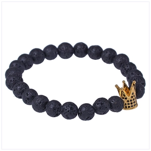 Lava stone bead bracelet with micro-paved black zircon crown accent on white background