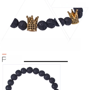 Macro detail of golden crown charm with black micro-inlaid stones on lava rock bracelet