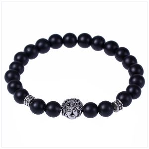 Detailed view of 8mm black lava stone beads with a silver lion head charm bracelet