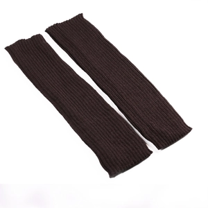 Detailed knit texture of dark brown leg warmers with elastic ribbed vertical patterns