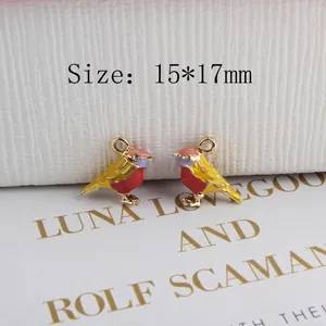 Macro shot of 15x17mm colorful enamel sparrow charms with gold outlines for DIY jewelry