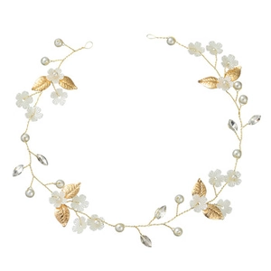Detail of bridal headband with white flowers, gold leaves, pearls and crystals
