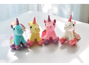 Detailed view of four colorful plush unicorn keychains in blue, yellow, pink, and white