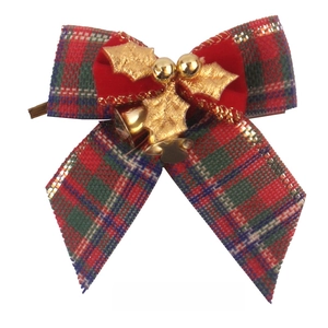 Detail of Christmas plaid burlap bow with gold bells and holly leaf for tree decoration