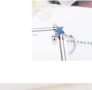 Detailed close-up showing S925 hallmark on silver ring with blue enamel star charm