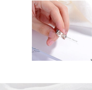 Detail of mixed-tone ring showing silver edges and rose gold cutout cloud patterns