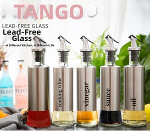 Detailed set of 5 glass oil and vinegar dispensers with stainless steel protective shells