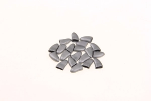Detail view of twenty grey soft silicone cat claw covers in a pile for scratch protection