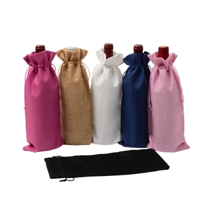 Linen wine drawstring bags in magenta, brown, white, navy, and pink on white background