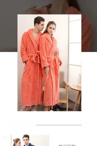 Detailed texture of coral orange flannel bathrobe with thick checkered relief pattern