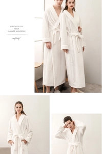 Detailed close-up of thick white flannel bathrobe featuring soft textured waffle fabric