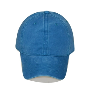 Front view of a blue washed cotton baseball cap with classic curved brim and six panels