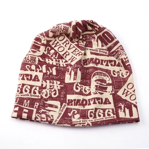 Detailed knit texture and burgundy graffiti newspaper print on off-white beanie