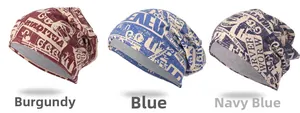 Three vintage newspaper print beanies in red, blue, and navy with soft grey lining