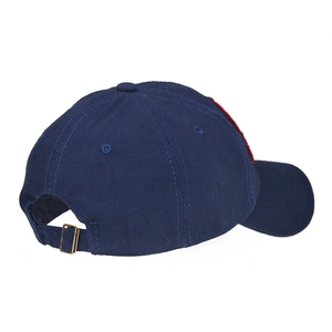 Detail view of navy cotton baseball cap showing adjustable bronze metal buckle and strap