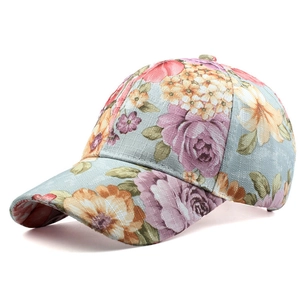 Close-up of a floral print baseball cap featuring detailed roses on light blue canvas fabric