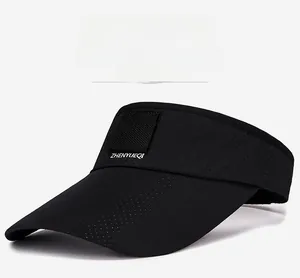 Detail of black breathable sun visor with laser-cut ventilation holes and velcro patch