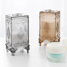 Detail of vintage embossed plastic cosmetic organizers in amber and grey translucent finish