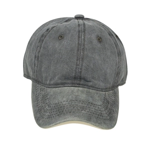 Detailed macro view of washed dark grey cotton canvas baseball cap with reinforced stitching