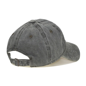Detail of washed cotton baseball cap with adjustable metal buckle and breathable eyelets