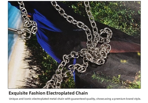 Detail of silver electroplated metal chain strap with polished finish on an evening bag