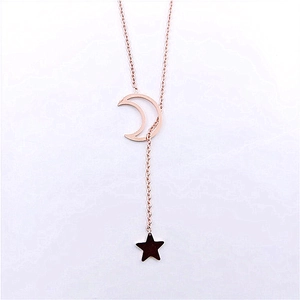 Detailed close-up of rose gold Y-necklace with hollow moon and black star pendants