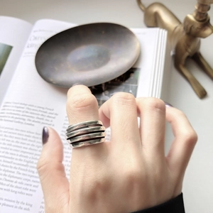 Macro shot of 925 sterling silver multi-layered spiral ring in a lifestyle setting