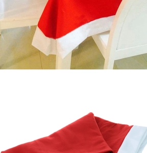 Detail of red Christmas chair cover with white border showing fabric texture and fit