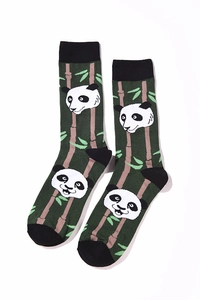 Detailed view of forest green cotton socks featuring jacquard panda and bamboo patterns
