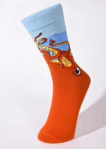 Close-up of orange crew sock featuring a cartoon octopus pattern and light blue cuff details