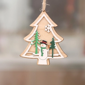 Wooden laser-cut Christmas tree ornament with snowman and pine trees details